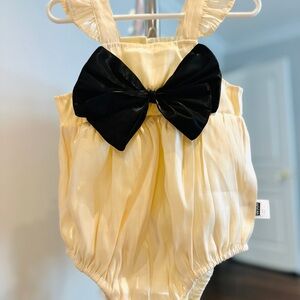 Cream Baby Romper with Black Bow